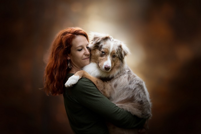 Woman holding a dog