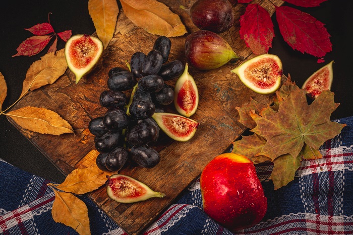 Still life of fruit and autumn leaves