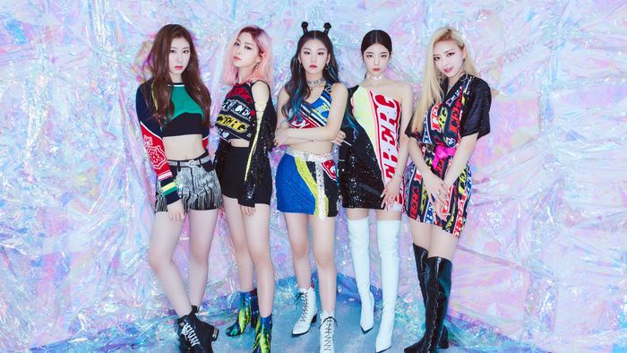 ITZY group posing in colorful outfits