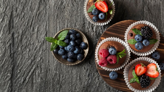 Chocolate cupcakes with berries and mint