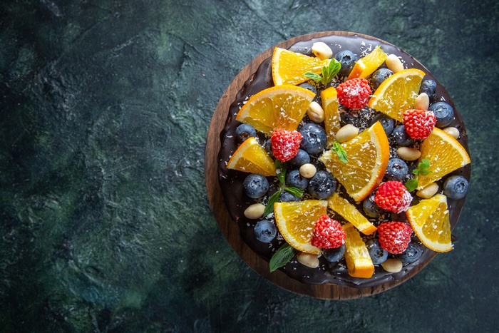 Chocolate cake with berries and oranges 4K