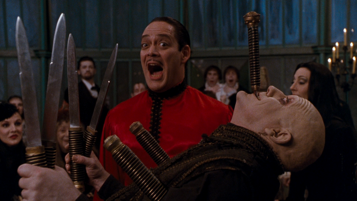 Gomez Addams and Uncle Fester with knives