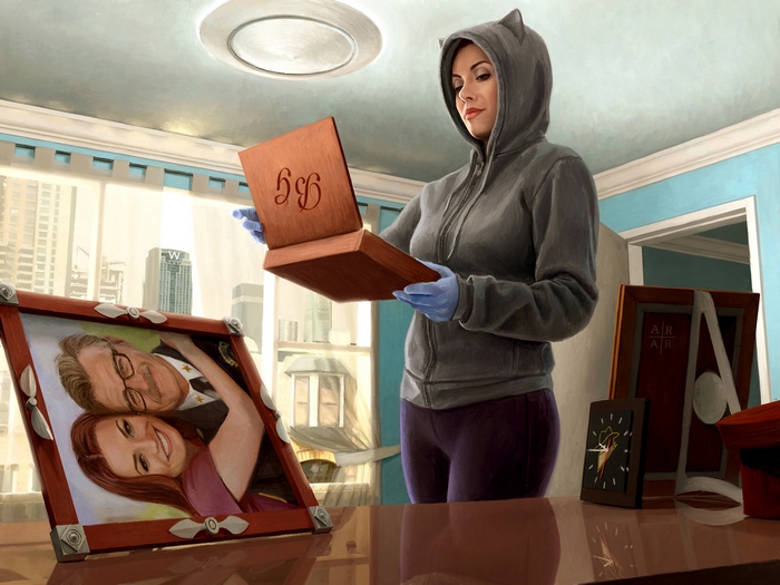 Catwoman holding a wooden box with initials