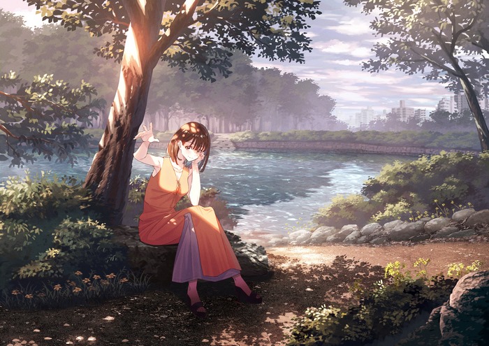 Girl with brown hair and eyes by the water
