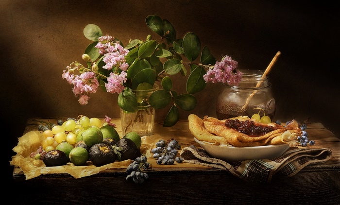 Still life with crepes, fruit, and flowers