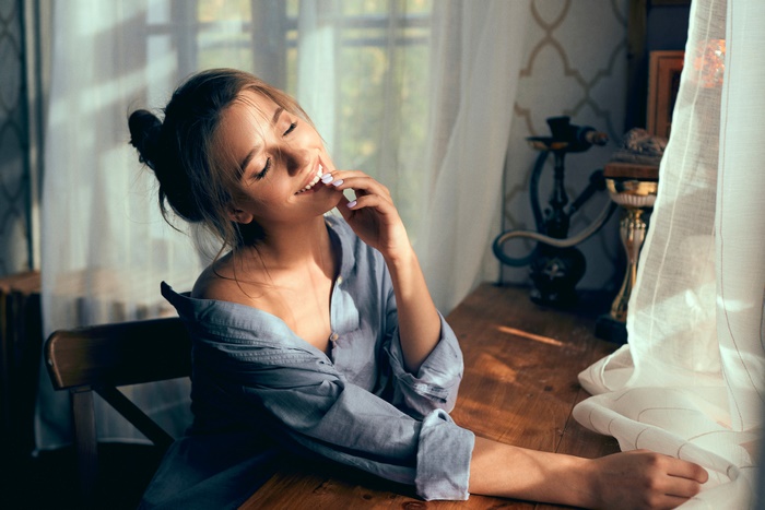 Brunette Woman Smiling in Soft Light
