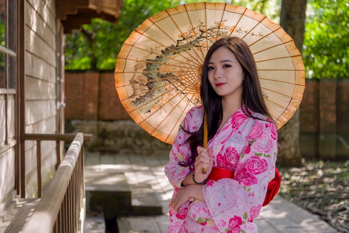 Woman in Kimono Holding an Umbrella