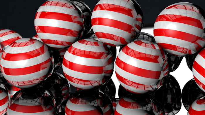 Red and white striped balls in 3D