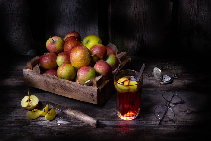 Still life of apples and a drink