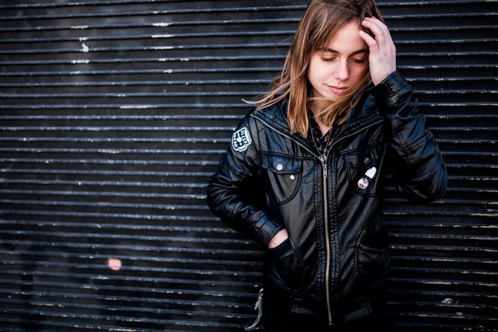 Julien Baker in a black leather jacket