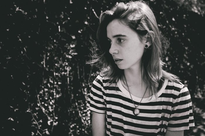 Julien Baker in a striped shirt