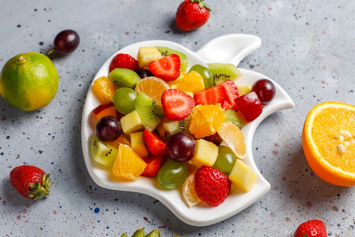 Fruit salad in an apple-shaped bowl