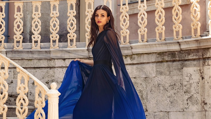 Victoria Justice in a blue and black dress