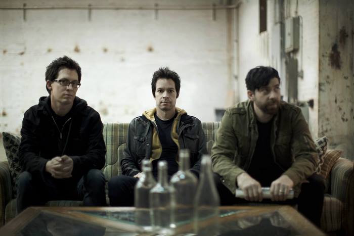 Chevelle band members sitting on a couch