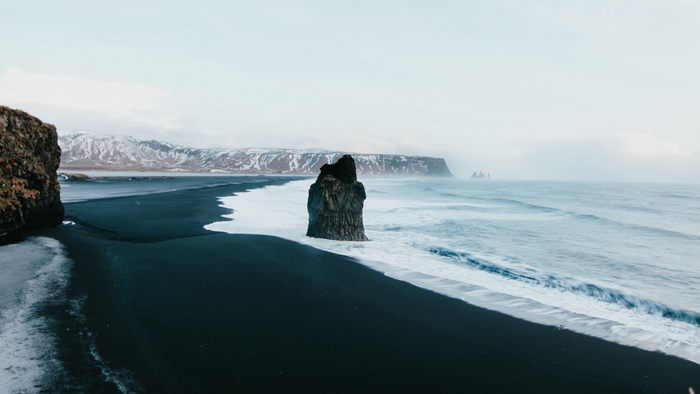 Black sand beach with rock formation in Iceland