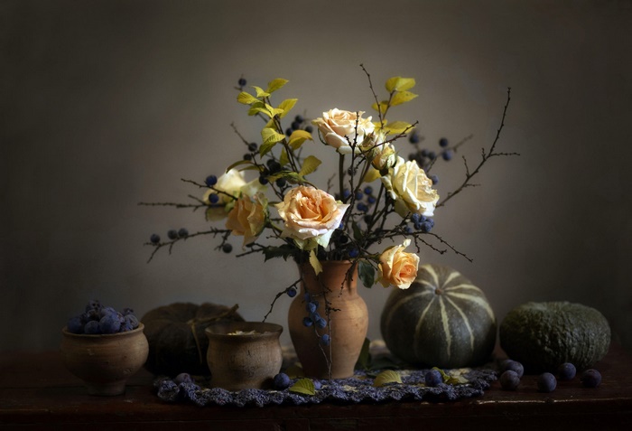 Still life with roses, pumpkins, and berries