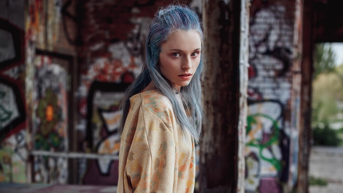 Model with Blue Hair in Graffiti-Covered Building