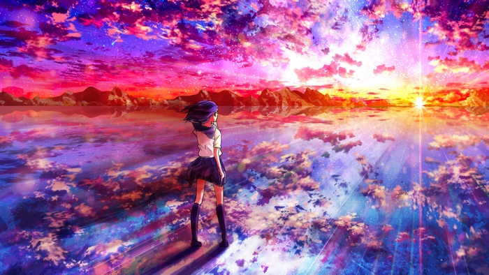 Girl watching a colorful sunset over a lake