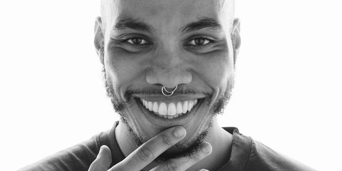 Anderson .Paak smiling with septum piercing