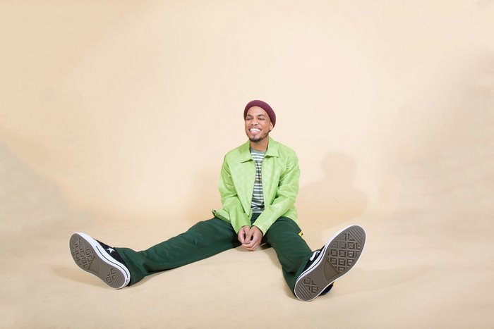 Anderson .Paak sitting on the floor
