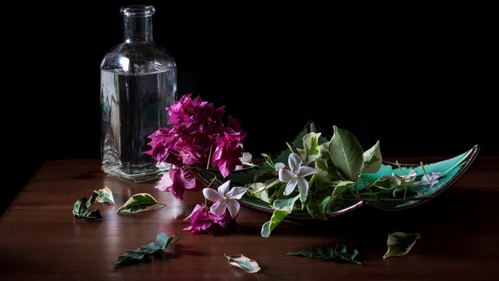 Still life with flowers and a bottle