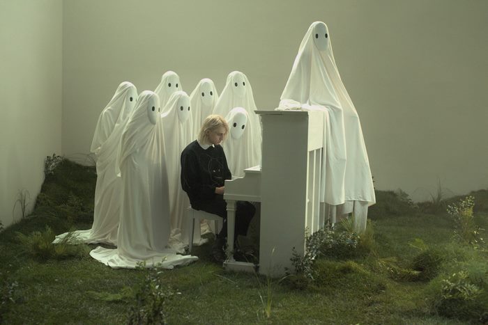 Porter Robinson and ghosts playing piano