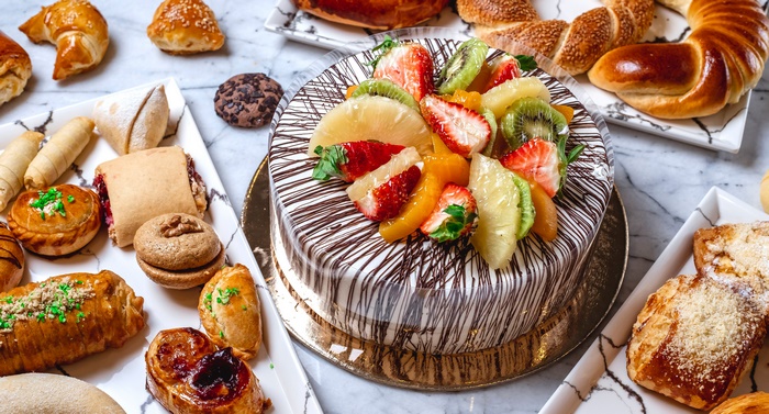 Cake and pastries on a marble table