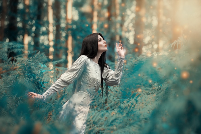 Woman with Black Hair Among Ferns