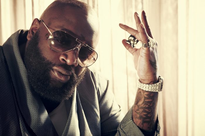 Rick Ross wearing sunglasses and jewelry
