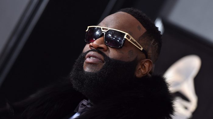 Rick Ross wearing sunglasses and a fur coat