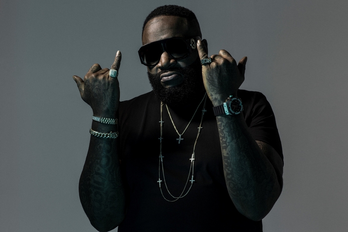 Rick Ross wearing sunglasses and jewelry
