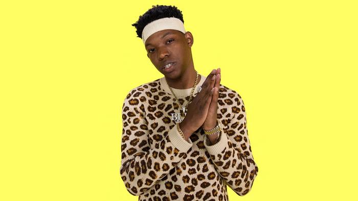 Yung Bleu wearing a leopard print sweater