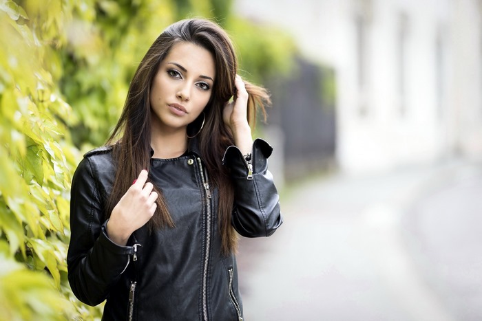 Young woman in a black leather jacket