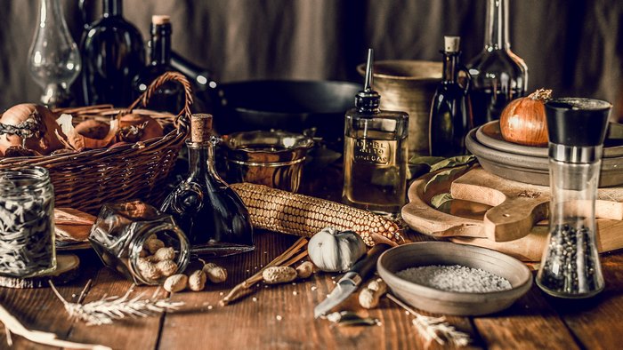 Groceries and Kitchen Utensils on a Wooden Table