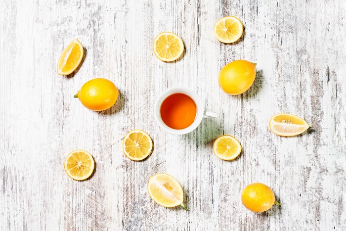 Tea and lemons on a wooden table