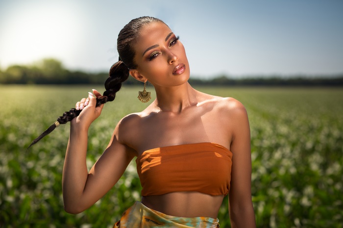 Woman with braid in a field