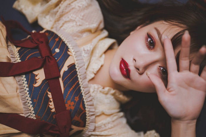 Woman with red lipstick and elaborate dress
