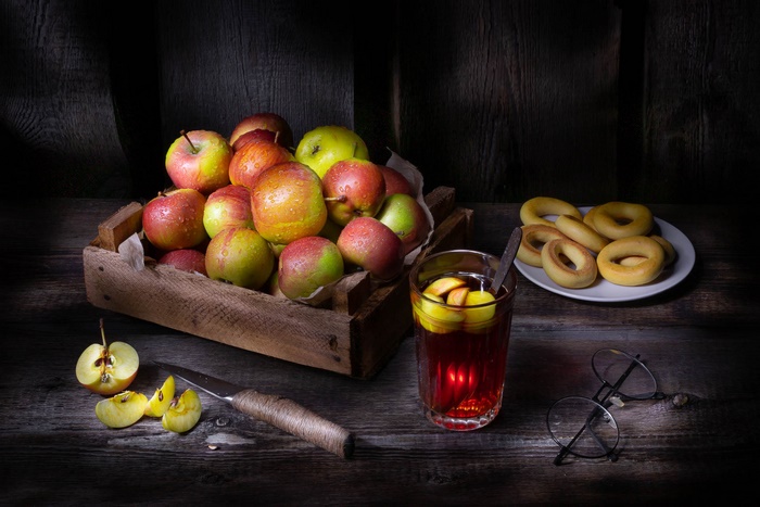 Still life with apples, drink, and bagels