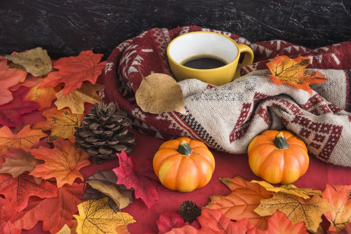 Autumn still life with coffee and pumpkins