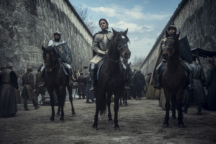Knights on horseback in a courtyard