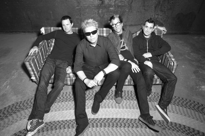 The Offspring band members sitting on a couch