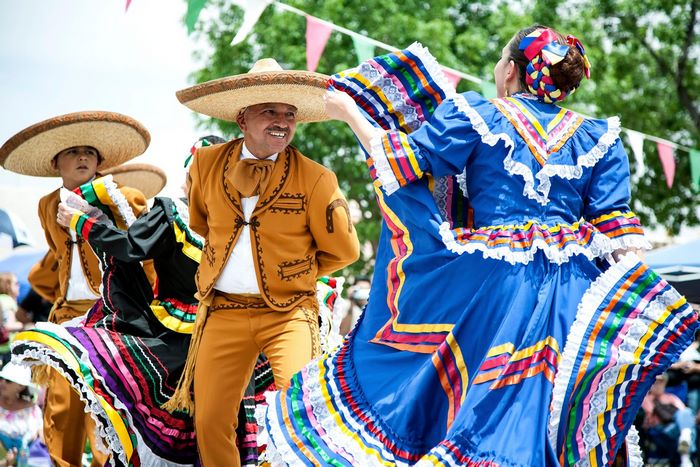 Mexican dancers in traditional attire performing