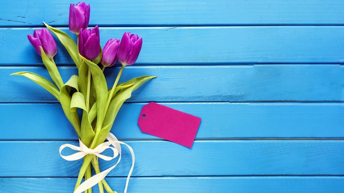 Purple Tulips with Pink Tag on Blue Wood