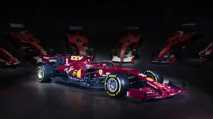 Ferrari SF1000 Formula 1 cars in a dark room