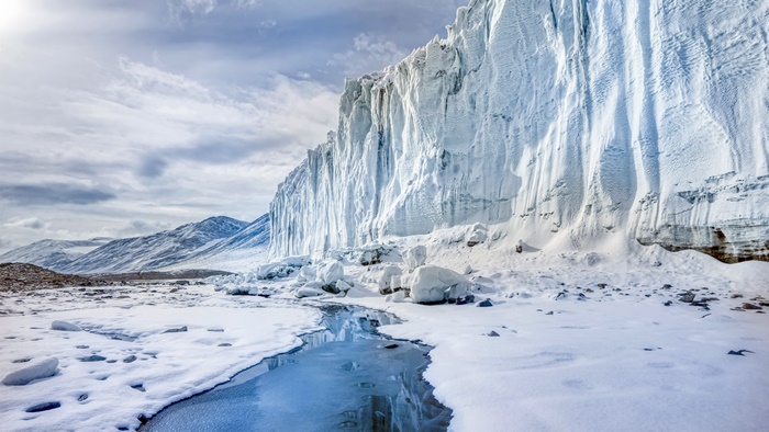 Antarctica 4K Cliff Face and Frozen Stream