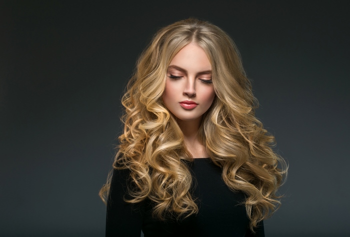 Portrait of Woman with Long Curly Blonde Hair