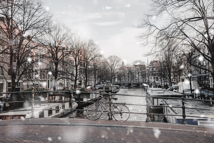 Amsterdam canal in winter with a bicycle
