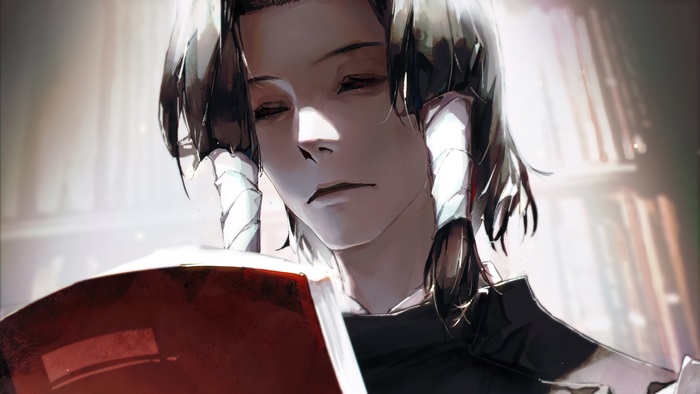 Noritoshi Kamo reading a book in a library