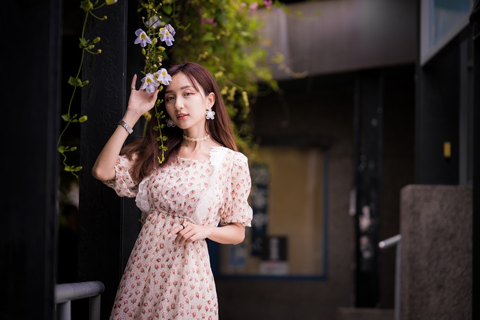 Asian Woman in Floral Dress with Flowers