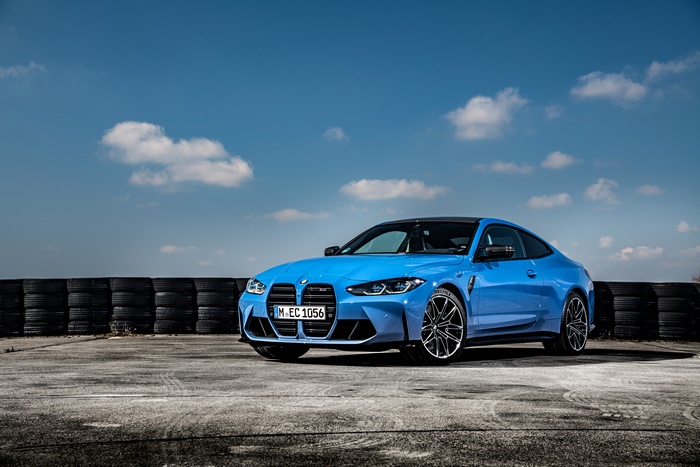 Blue BMW M4 Coupe on a Race Track